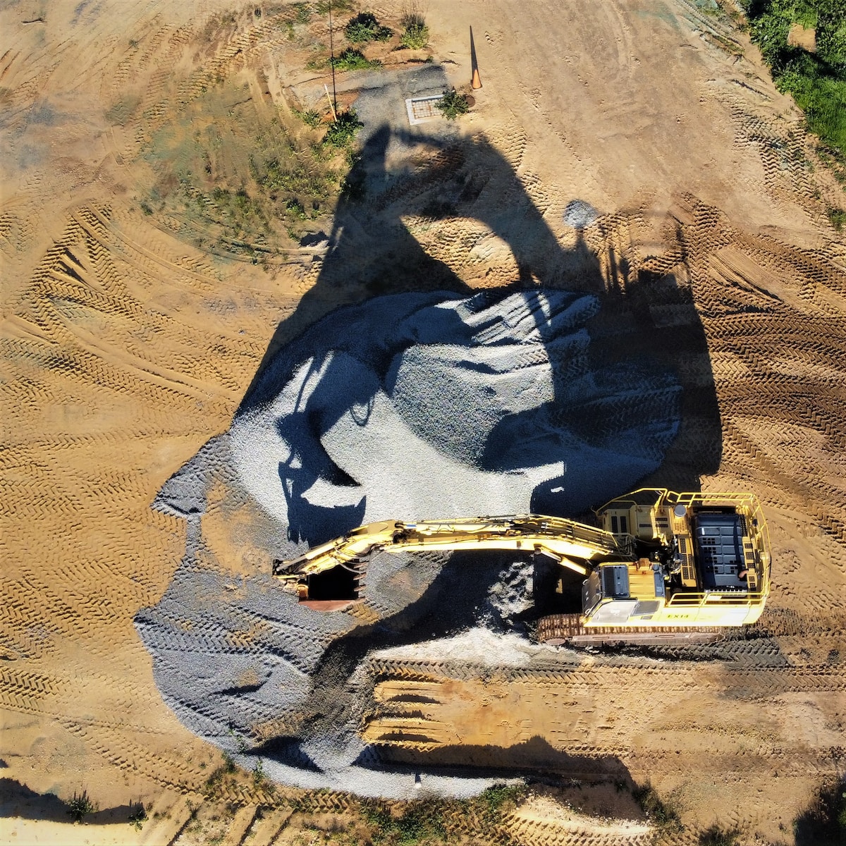 an aerial view of a construction site with a bulldozer